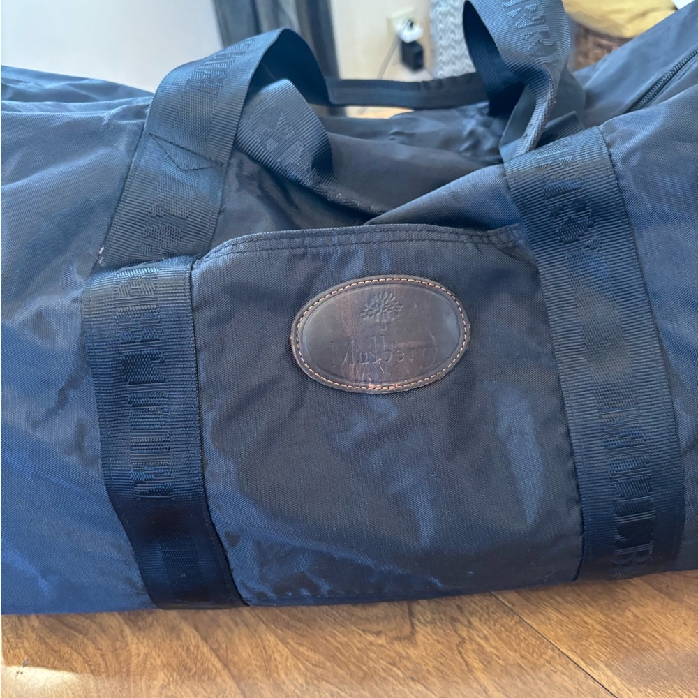 Mulberry Black Duffel Bag with Durable Fabric and Cylindrical Shape